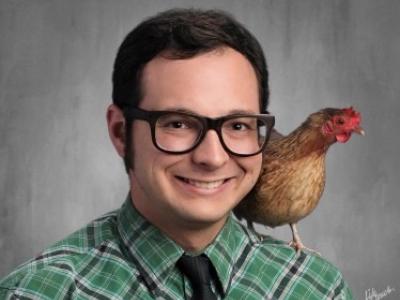 Image of Mr. Kniesly, with a chicken on his shoulder.